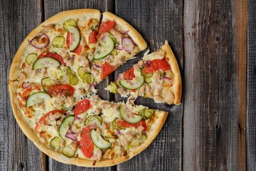 Delicious pizza with chicken cheese and vegetables