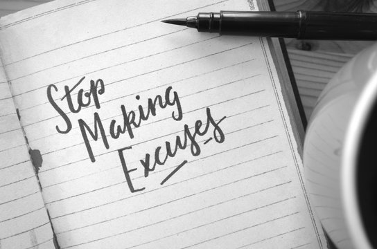 STOP MAKING EXCUSES hand-lettered in notebook