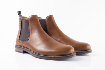 Male brown leather boot on white background, isolated product, Footwear.