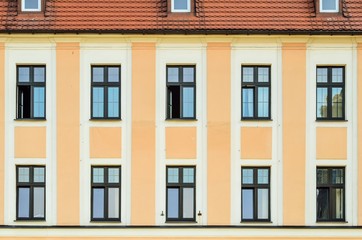 Historic architecture detail. Wall of old building on the market in Pszczyna, Poland.