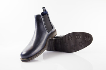 Male blue leather shoe on white background, isolated product, comfortable footwear.