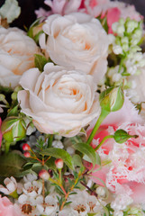 Beautiful pink white wedding bouquet with rose flowers closeup background