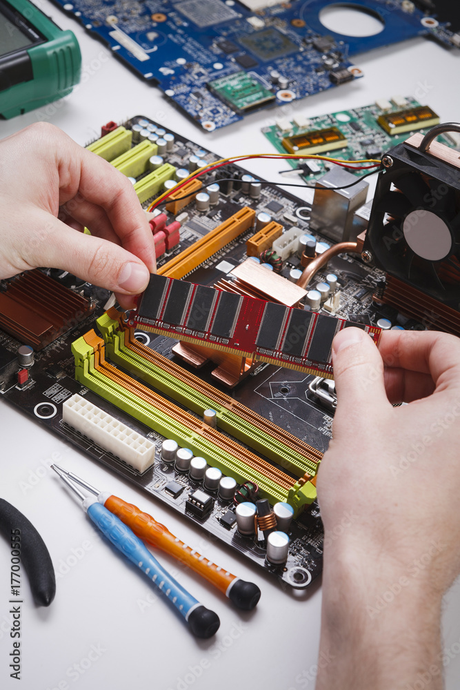 Poster technician plug in microprocessor to motherboard