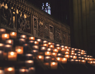 Lit Candles inside church Notre Dame de Paris, France
