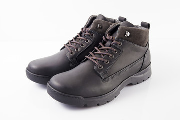 Male black leather boot on white background, isolated product.