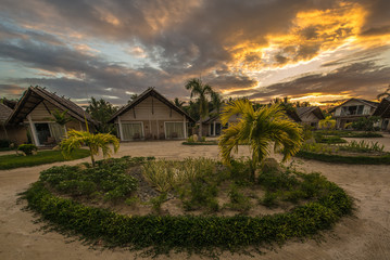 Small guest houses over a beautiful sunset. Philippines. The island of Palawan.