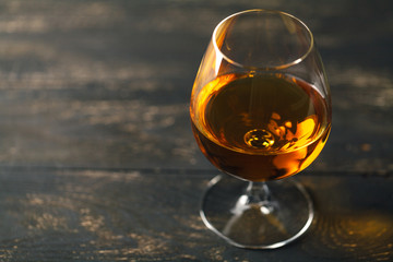 Brandy glass on the wooden table