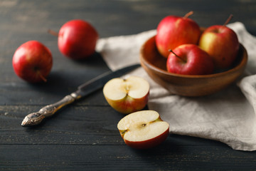organic healthy apples in bowl on wooden board. Healthy food