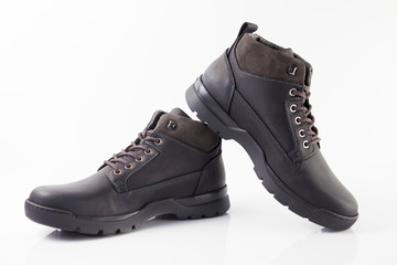 Male black leather boot on white background, isolated product.