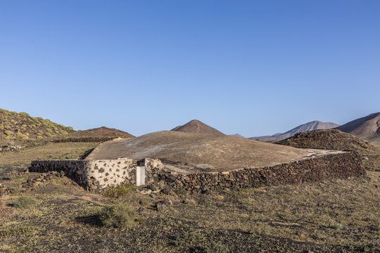 volcanos in Timanfaya national park near Mancha Blanca and old cistern