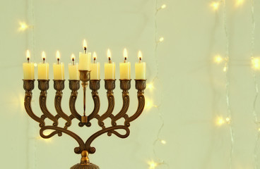 Fototapeta na wymiar image of jewish holiday Hanukkah background with menorah (traditional candelabra)