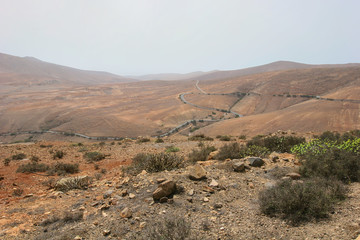 Spectacular aerial view on picturesque road through mountain desert in Fuerteventura island, Canary Islands, Spain