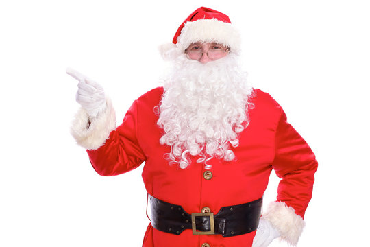 Kind Santa Claus pointing in white blank sign, isolated on white background
