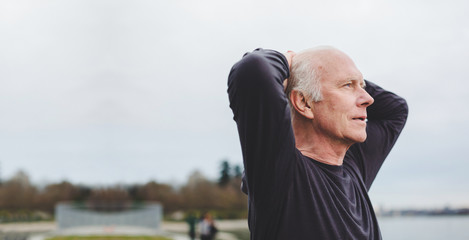 Tired senior man breathing after exercise workout