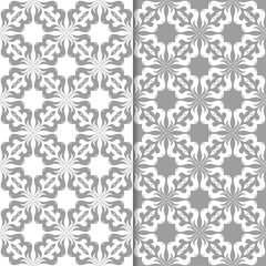White and gray floral backgrounds. Set of seamless patterns