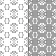 White and gray set of floral seamless patterns