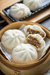 chinese steamed buns on wood container , selective focus