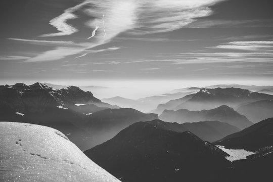 panorama view of the italian alps coverd in early-morning haze - black and white