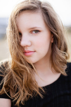 Portrait of a teen girl in black top