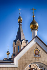 Little orthodox church golden cupola entrance gates