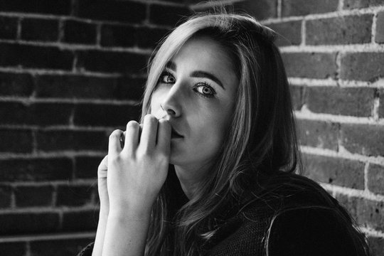 young attractive female with bright eyes looking directly at camera