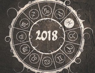 Astrological symbols in the circle. Pisces sign. New Year and Christmas celebration card template. Zodiac circle with 2018 new year number. Grunge concrete wall texture