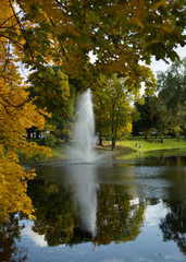 Golden autumn in a city park. Fountain in the Bastelkajna park in Riga, Latvia. © Jeena