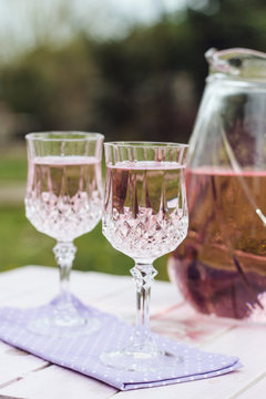 Pitcher and glasses on a little table in the garden