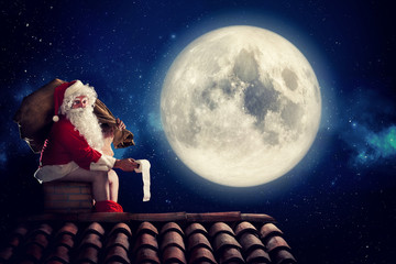 Nasty Santa Claus poop in a chimney under moonlight as bad children gift. Alternative Christmas...