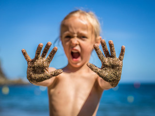 little girl with dirty hands