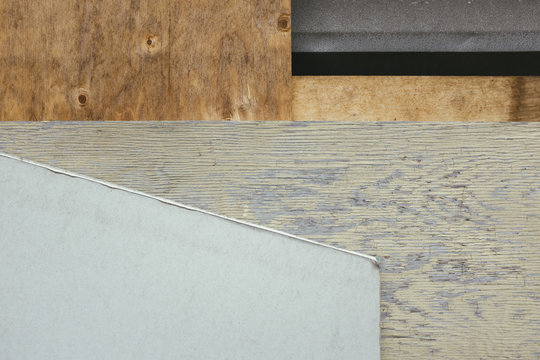Pieces of discarded plywood and drywall