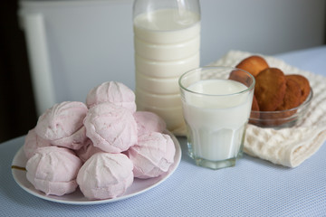 Breakfast or lunch with milk and marshmallows and cookies