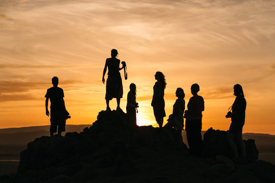 Silhouettes of people in desert
