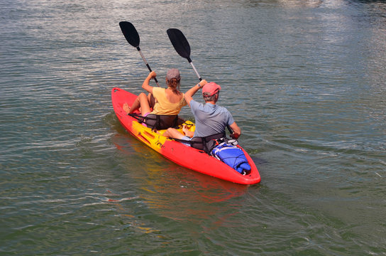 Couple kayaking on a Sunday afternoon off Miami Beach on the Florida Intra-coastal Waterway .