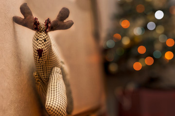 reindeer puppet with blurred background and lights