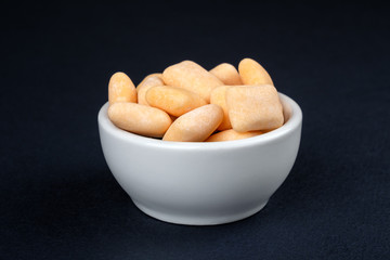 Colored chewing gum in a bowl