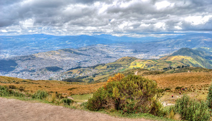 Fototapeta na wymiar View of the city of Quito and the ecuadorian Andes from the Teleferico touristic attraction, at the top of the Pichincha volcano. Quito, Ecuador.