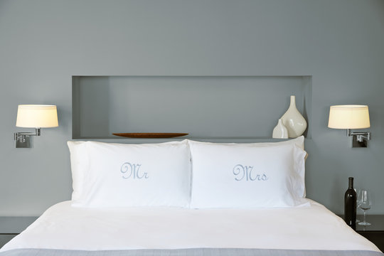 Mr & Mrs Pillowcases on bed in bedroom