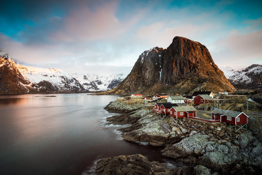 The sun rises over Reine