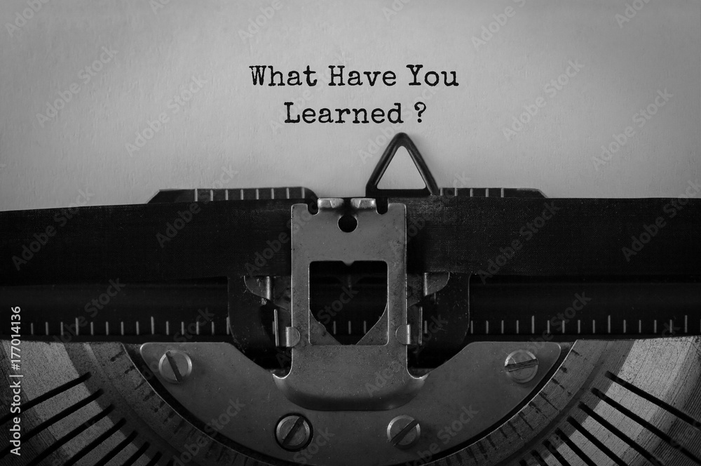 Aufkleber Text What Have You Learned typed on retro typewriter
