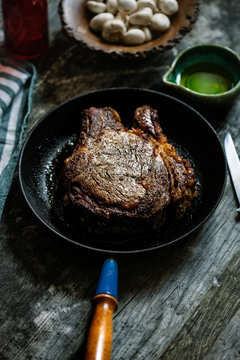 Cooked prime rib in cast iron pan.