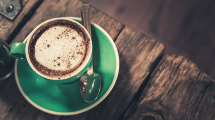 A Green Cup Of Hot Cappuccino Coffee
