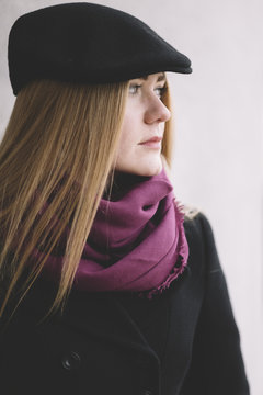 young woman with  black hat on the street .