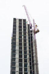 high tall buiding with crane