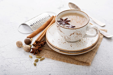 Warm chai tea with winter spices - obrazy, fototapety, plakaty