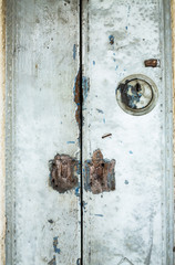 Old rusty metal lock with old wooden door, closeup