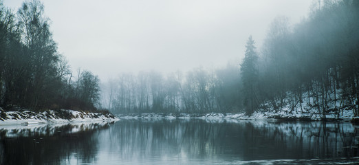 Fog over a river in winter