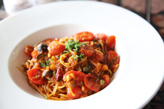 Spaghetti witn tomato and olive , Italian food