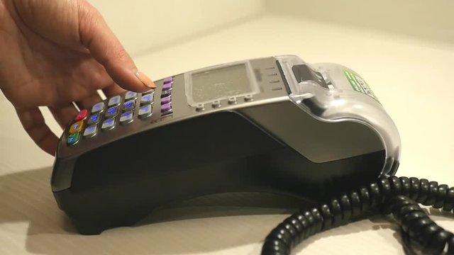 Make a purchase through a bank terminal, carry out a credit card. close-up, slowmotion, 1920x1080, hd