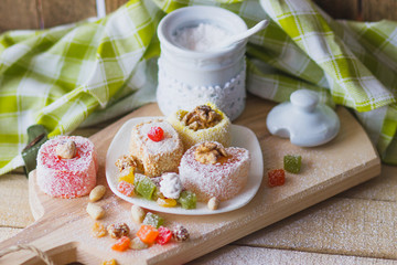 East sweets with candied fruits, nuts and sugar powder